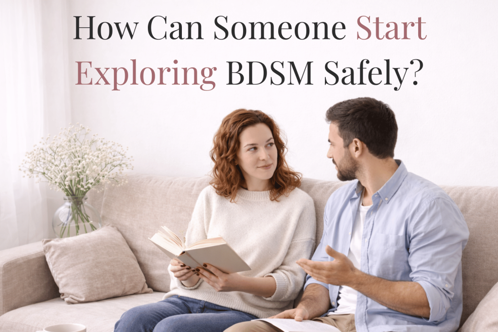 Couple sitting on a couch having a calm conversation while reading together, with text reading ‘How can someone start exploring BDSM safely,’ representing open communication, consent, and beginner BDSM education.